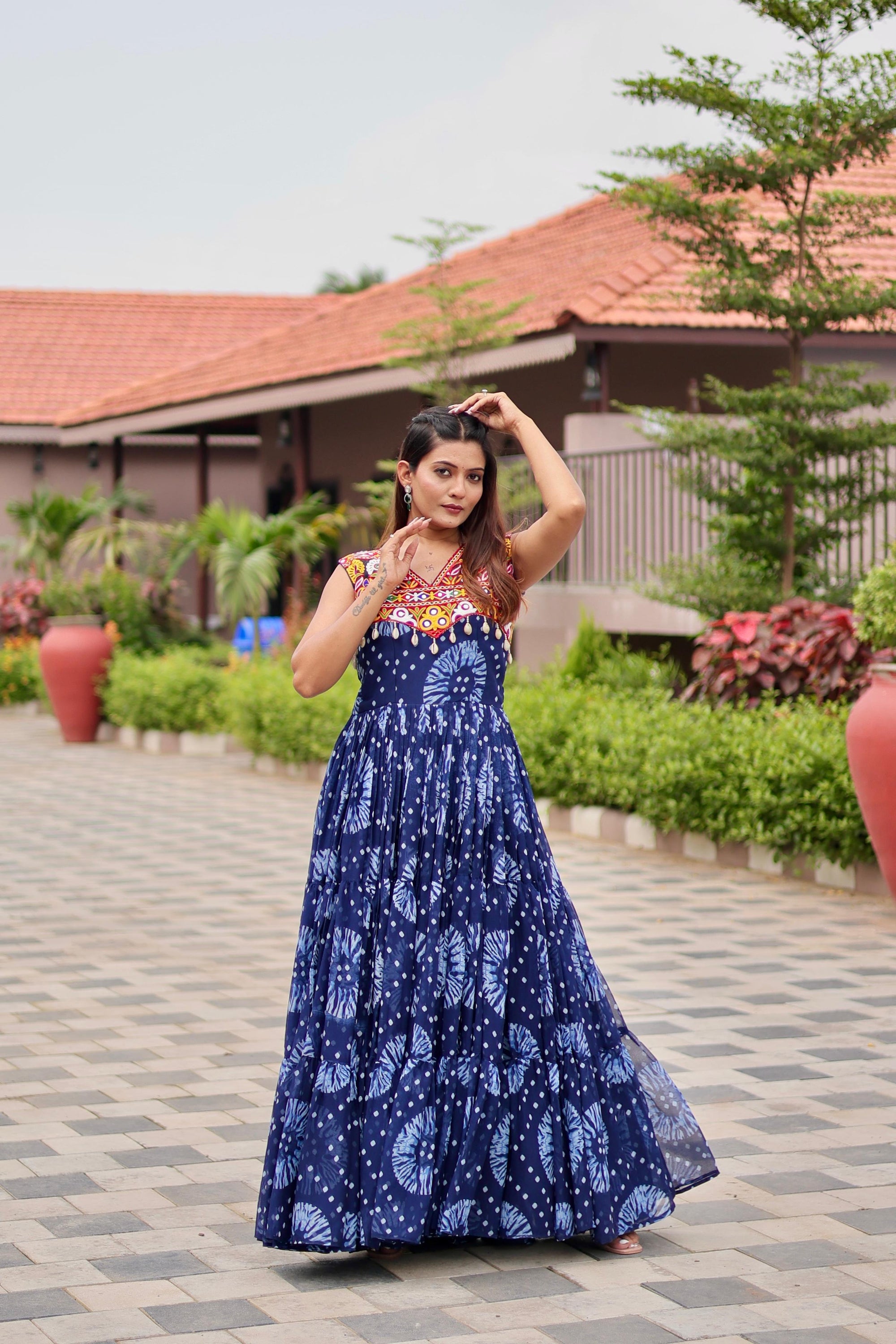 Celebrate The Spirit Of Navratri In This Vibrant Faux Georgette Gamthi Work Gowns