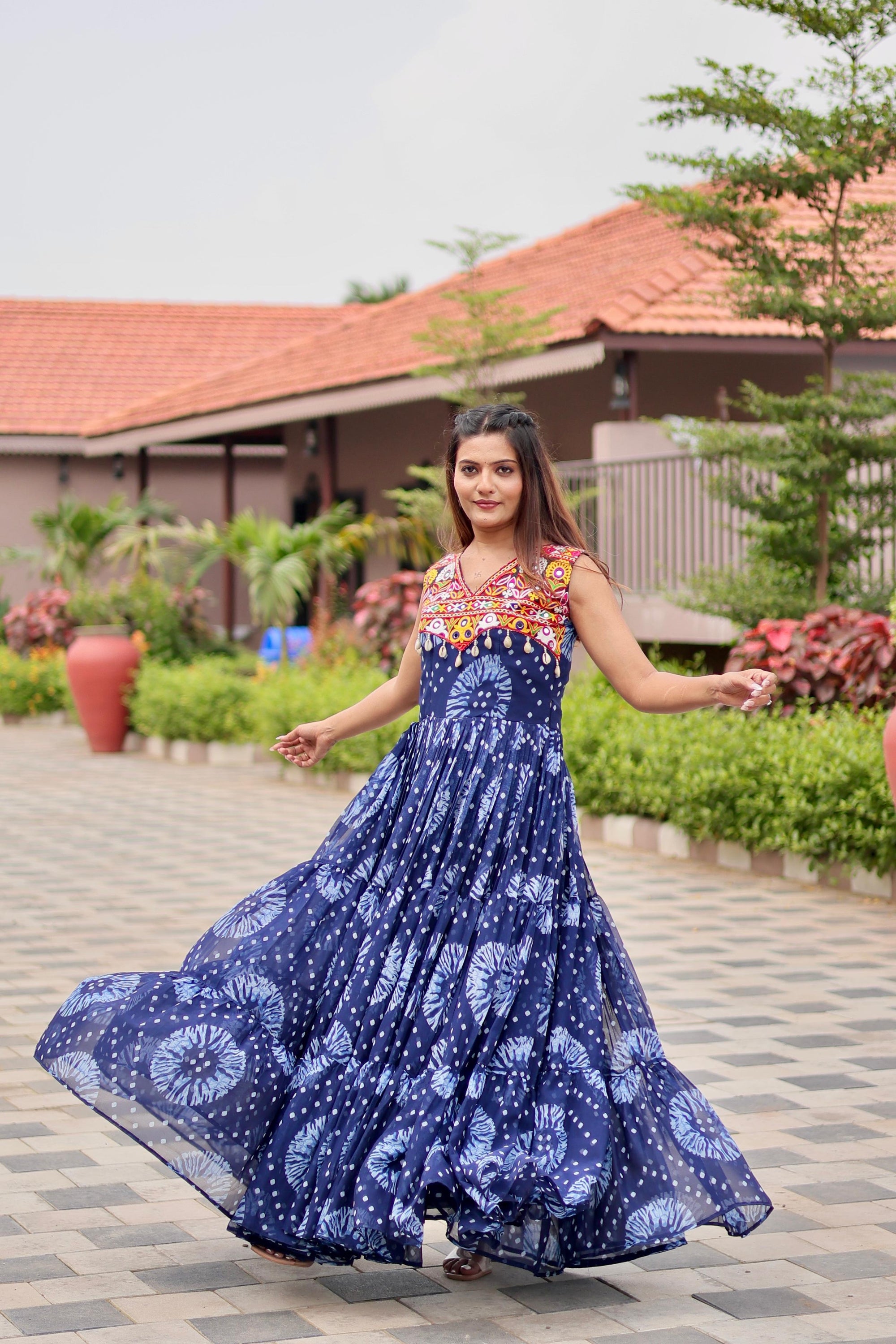 Celebrate The Spirit Of Navratri In This Vibrant Faux Georgette Gamthi Work Gowns