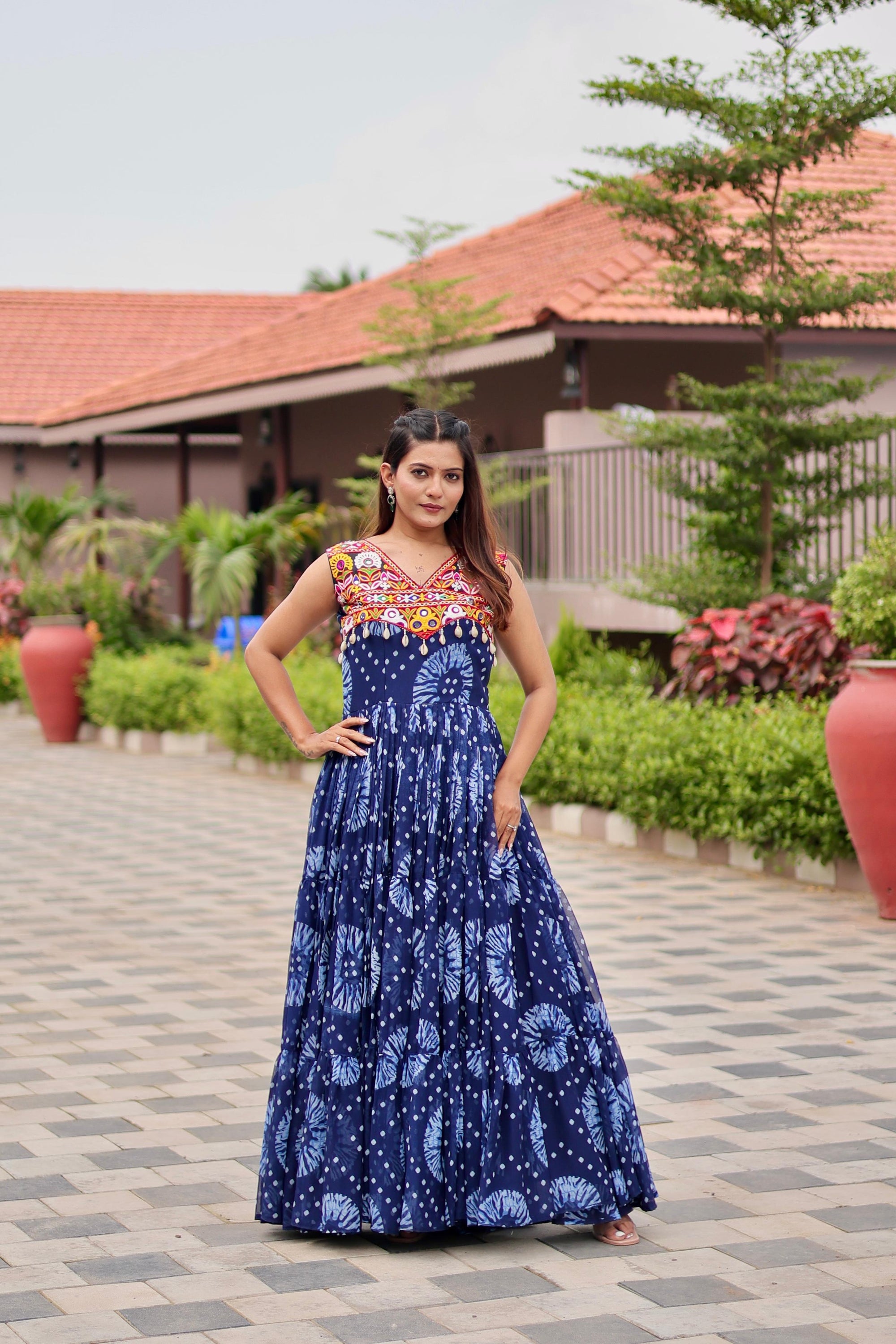 Celebrate The Spirit Of Navratri In This Vibrant Faux Georgette Gamthi Work Gowns